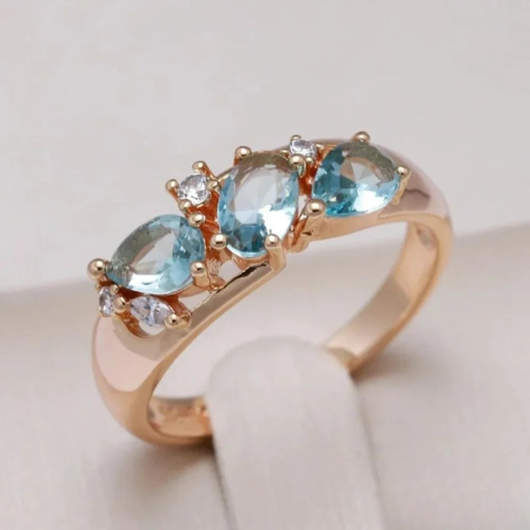 Anillo de oro con circonita azul
