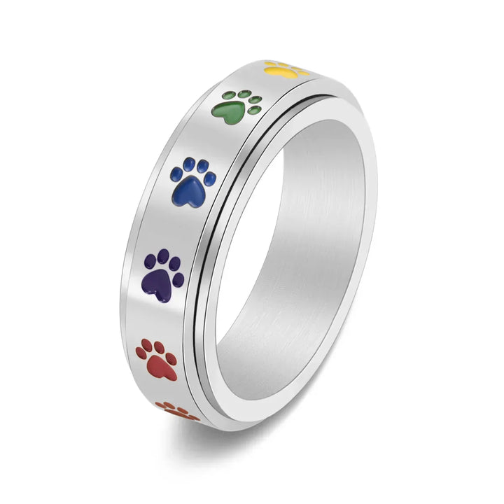 Anillo Antiestrés Ajustable con Huellas – Anillo de Acero Inoxidable en Tonos Arcoíris
