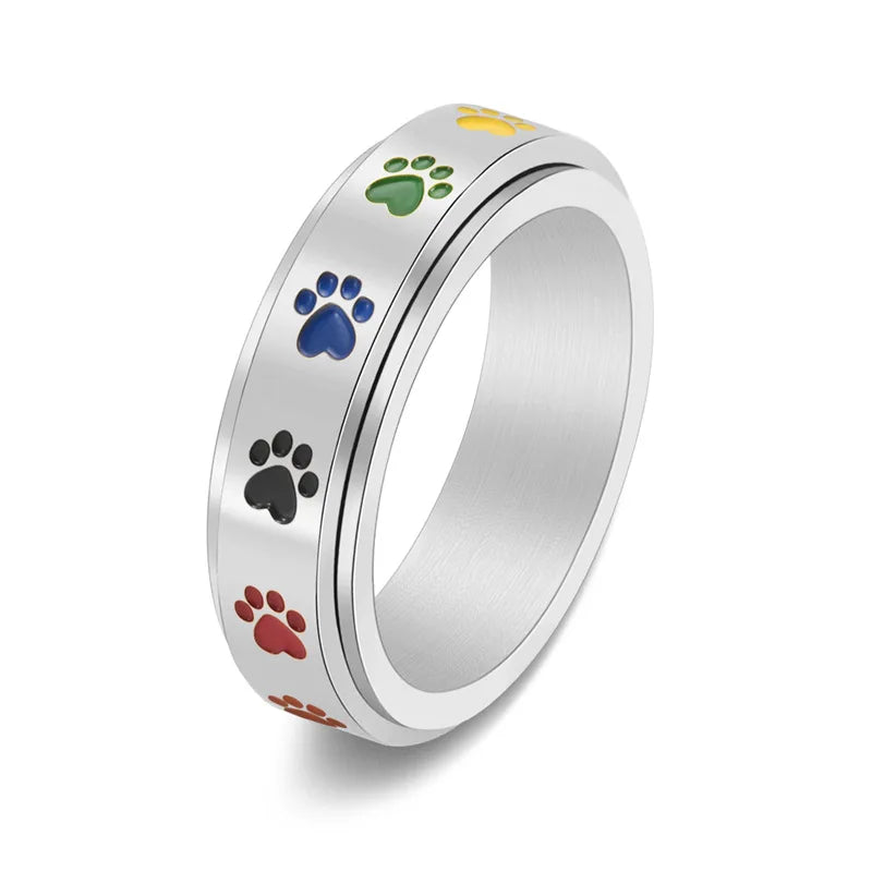 Anillo Antiestrés Ajustable con Huellas – Anillo de Acero Inoxidable en Tonos Arcoíris