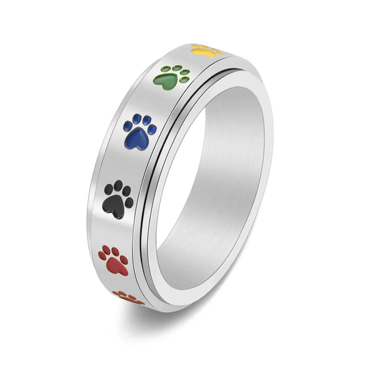 Anillo Antiestrés Ajustable con Huellas – Anillo de Acero Inoxidable en Tonos Arcoíris